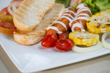 hotdog with ketchup mustard and vegetable