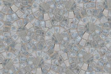 Cobble circular pattern block pavement texture background. Top view