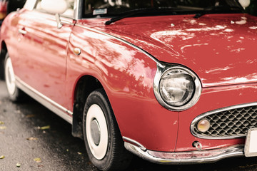 Obraz na płótnie Canvas close up of a red vintage car