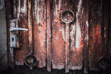 Low key lighting Old door background, Old door light and shadow, Conservative with toned color and selective focus.