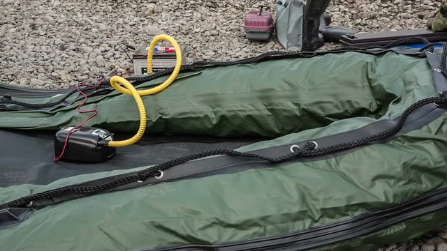 the boat PVC is pumped up by air by means of the electric pump