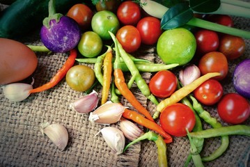 pepper, lemon,garlic,tomatoe,lemon grass, eggplant, fresh mix vegetable on sacking top view 