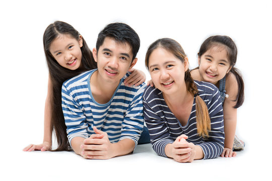 Asian family smiling and lying on isolated white background, Happy family