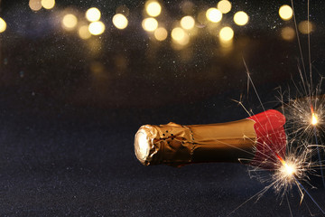 Abstract image of champagne bottle and festive lights
