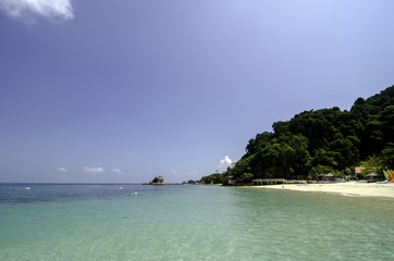 scenic sea view of the Kapas Island at Terengganu, Malaysia. Clear sea water and blue sky background. Rocky island and cloudy sky at sunny day.image taken at Kapas Island (Cotton Island), Malaysia