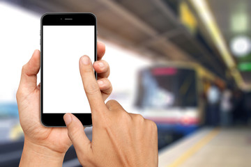 Hand are holding and touch Smartphone with sky train background