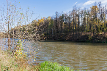 Landscape on a city pond in sunny autumn day