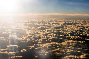 Sun flare above a dense layer of cloud