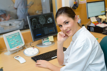 Female nurse analysing scan imagery