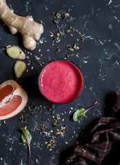 Beet and Ginger Detox Elixir. On a dark background, top view