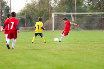 Obraz premium Little football player in action