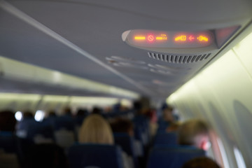 Fasten seat belts and no smoking signs in plane