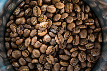 Coffee beans in metal jar. Image for your background