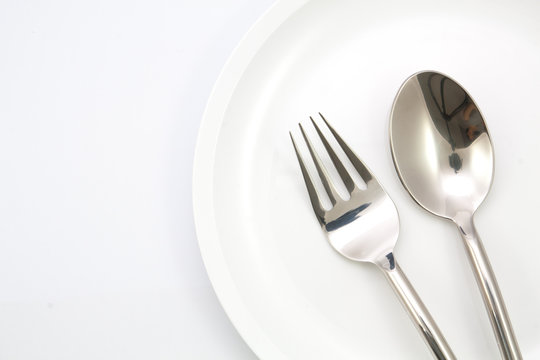 plate with fork and spoon  isolated
