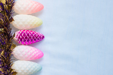 Christmas background with colorful cones and tinsel