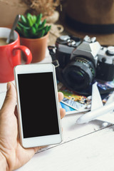 traveler hands with blank smartphone screen