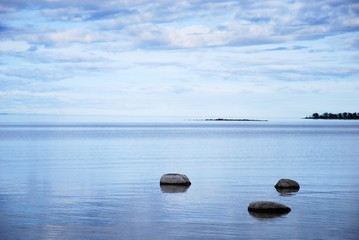 Coastal view with rocks in calm water