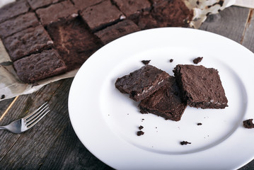 Cake chocolate brownies on white plate 