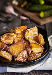 Baked potato wedges with garlic, christmas garnish