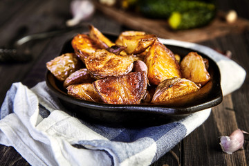 Baked potato wedges with garlic, christmas garnish