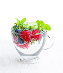 Detox  water. Homemade summer fruit drink with raspberry and blu