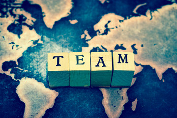 TEAM on grunge world map