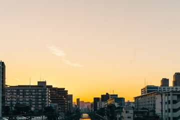 City at riverside at sunset