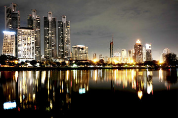 HIGH RISE BUILDING AT NIGHT
Cityscape of group of buildings standing behind a big lake at night.