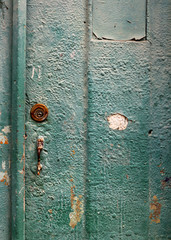 green vintage wooden door with handle