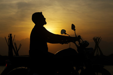 Obraz na płótnie Canvas Silhouette man with Bike
