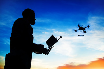 Man handing drone in the nature