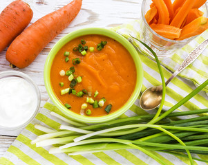 Carrot puree soup with sour cream and green onion