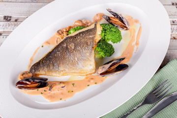 Fish fillet with seafood sauce