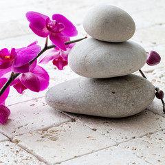 Fototapeta na wymiar wellbeing, meditation and femininity with stack of balancing pebbles