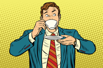Businessman drinking Cup of coffee looking sideways