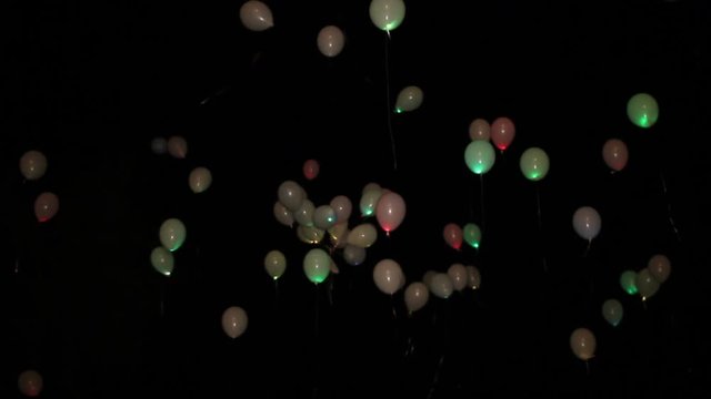 LED balloons burning fly away at night