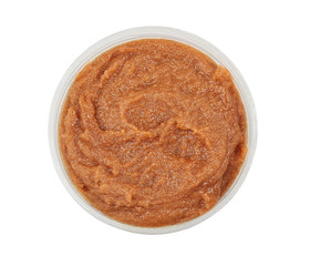 Natural scrub in container on white background
