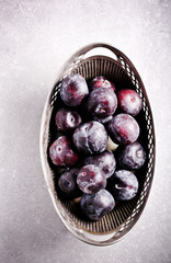 Plums in vintage vase