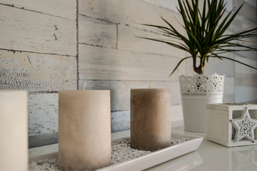 Interior decoration sandy with candles and plant