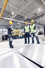 Workers working with aluminium billets