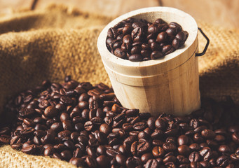 coffee beans in wood bucket.