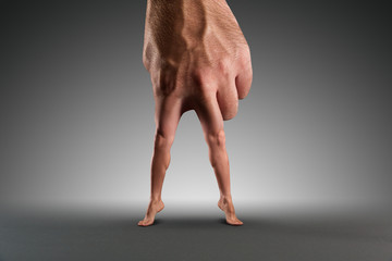 Male hand with legs