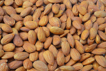 Closeup of whole almond nuts for background
