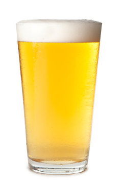 Foam head pint of light lager pilsner beer isolated on white background for use alone or as a design element