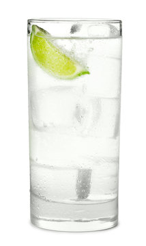Tall highball gin and tonic cocktail sparkling water soda with lime  isolated on white background