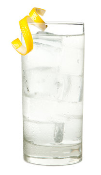 Highball vodka tonic or soda alcoholic cocktail with lemon twist isolated on white background