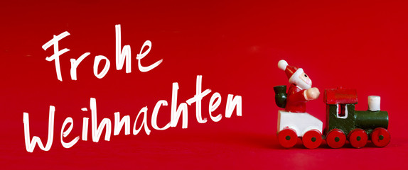 Naklejka premium Typical german wooden decoration for Christmas time of a man upoupon a train with handwritten 