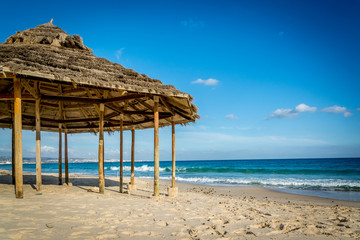 Old beach house on the beach in the afternoon