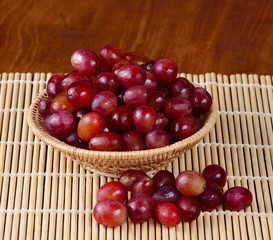 grape isolated on wooden background.