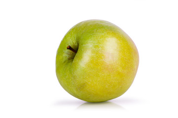 green apple lying on its side on a white background